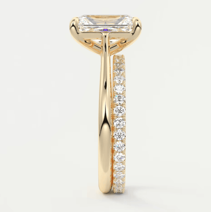 18k yellow gold engagement ring with a princess cut diamond and pave set diamonds on the band.
