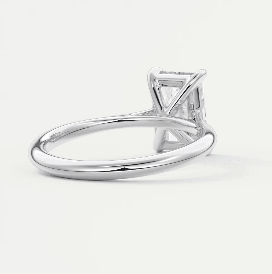 18k white gold solitaire engagement ring with a princess cut diamond.