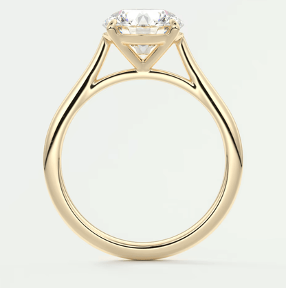 18k yellow gold engagement ring with a cushion-cut diamond.