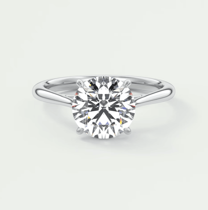 18-karat white gold solitaire diamond engagement ring.