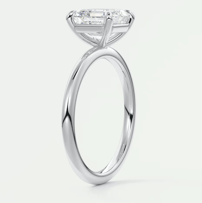 18-karat white gold engagement ring with a princess-cut diamond.