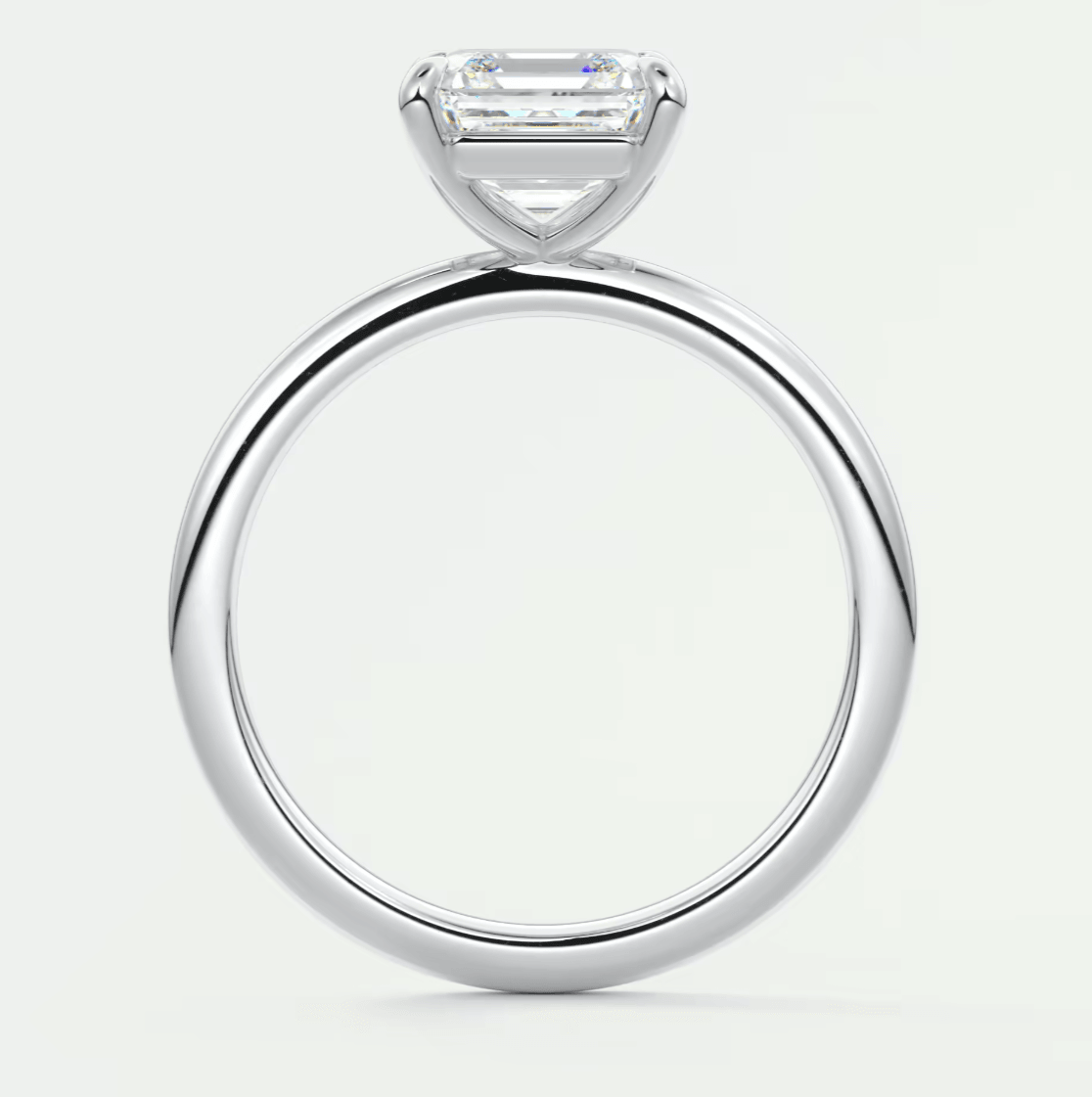 18k white gold engagement ring with a princess cut diamond.