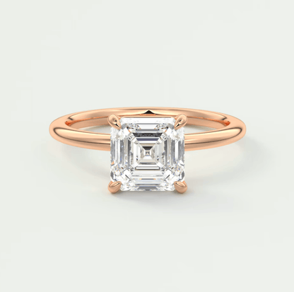 18-karat rose gold engagement ring with a square-cut diamond.