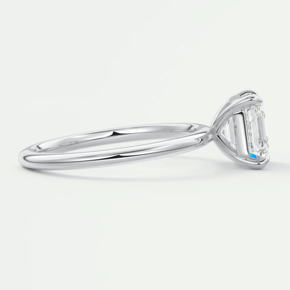 18k white gold engagement ring with a baguette-cut diamond.