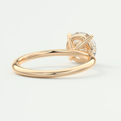 18k rose gold engagement ring with a round diamond.