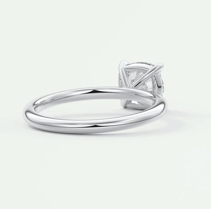 White gold solitaire engagement ring with a princess cut diamond.