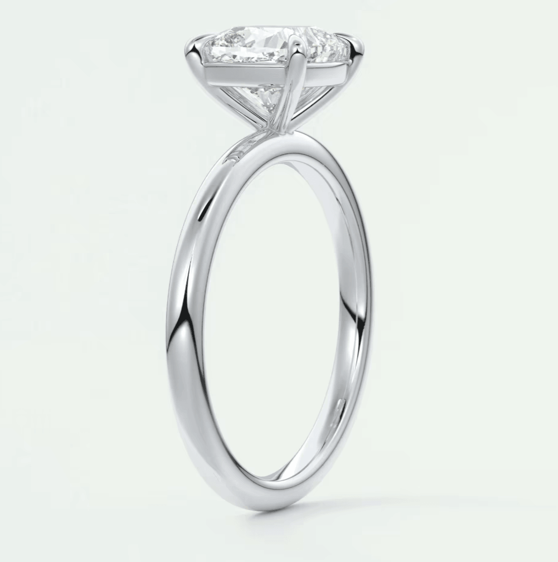 Princess cut diamond engagement ring with white gold band.
