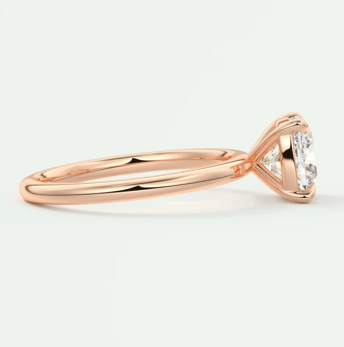 18-karat rose gold engagement ring with a marquise-cut diamond.