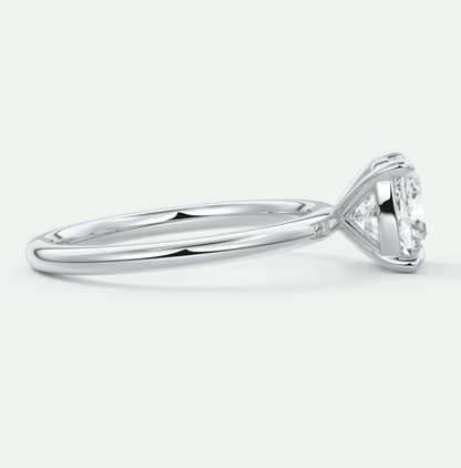 White gold solitaire diamond engagement ring with a classic claw setting.