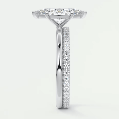 White diamond engagement ring with a halo design and side stones.