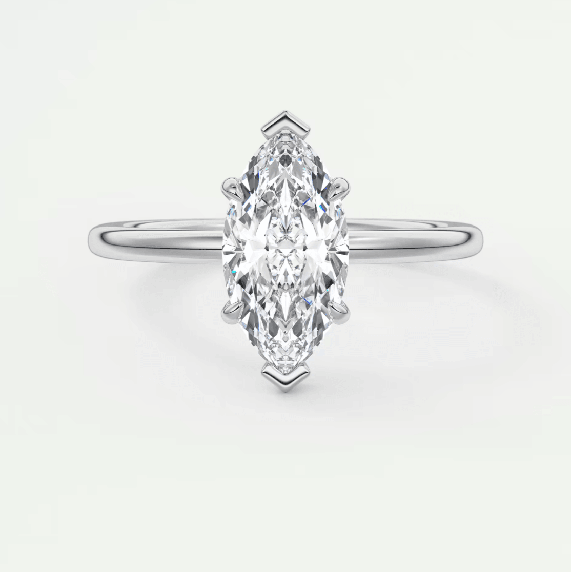 Marquise-cut diamond engagement ring with a white gold band, featuring an elegant and timeless design.