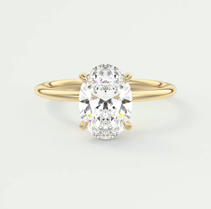 18k yellow gold oval diamond engagement ring with a solitaire design.