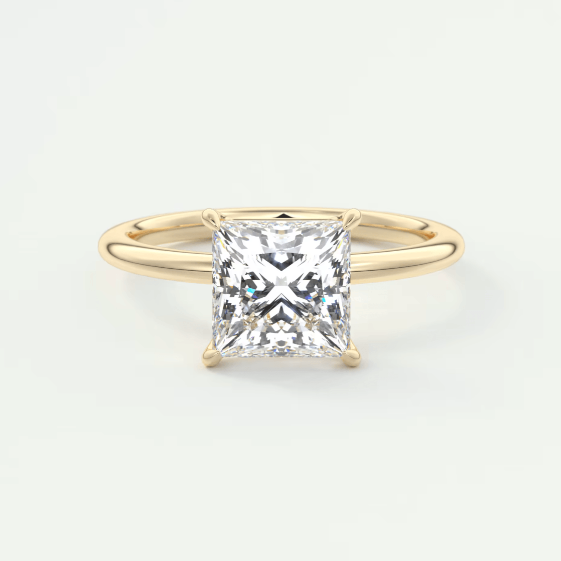 Princess cut diamond engagement ring with gold band, 14k yellow gold.