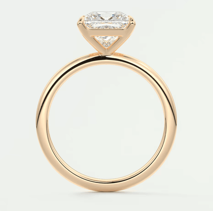 18k yellow gold engagement ring with a princess cut diamond and small side diamonds.