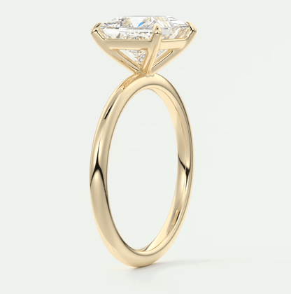 18k yellow gold engagement ring with princess cut diamond.