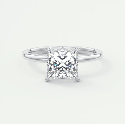 Princess cut diamond engagement ring with white gold band.