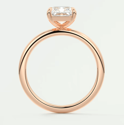 18-karat rose gold engagement ring with a rectangular diamond.