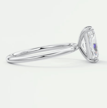 18k white gold engagement ring with a rectangular diamond.