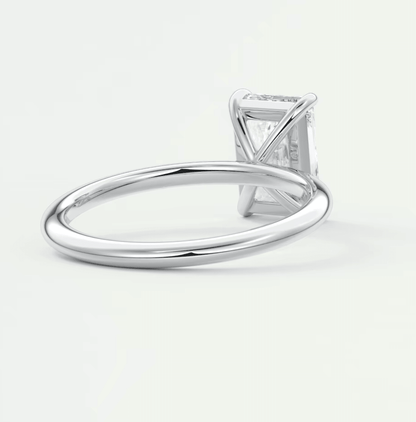 18-karat white gold solitaire engagement ring with a princess-cut diamond.