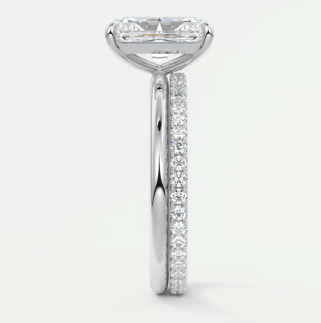 18k white gold engagement ring with princess cut diamond and pave set diamonds on band.