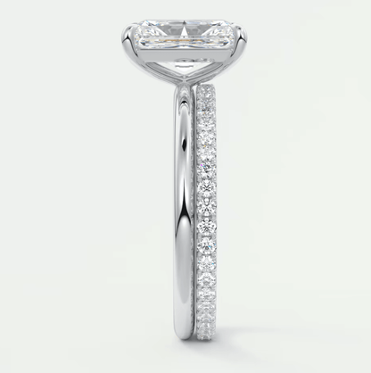 18k white gold engagement ring with princess cut diamond and pave set diamonds on band.