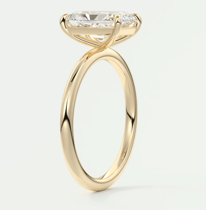18k yellow gold engagement ring with a princess cut diamond.