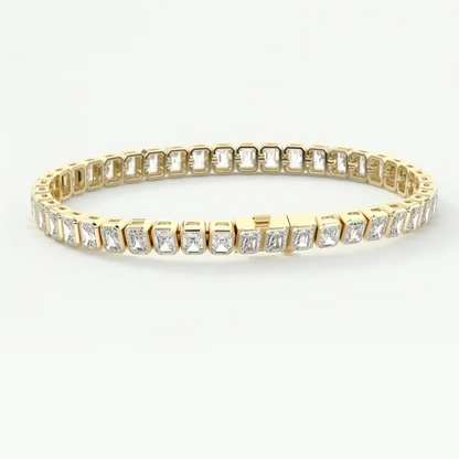 A yellow gold tennis bracelet featuring rectangular baguette-cut clear stones in a continuous row, displayed on a clean white background.