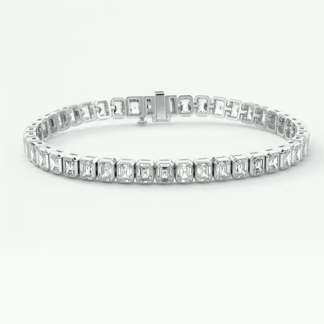 A silver white gold bracelet featuring baguette-cut clear stones in a continuous link design, displayed on a clean white background.