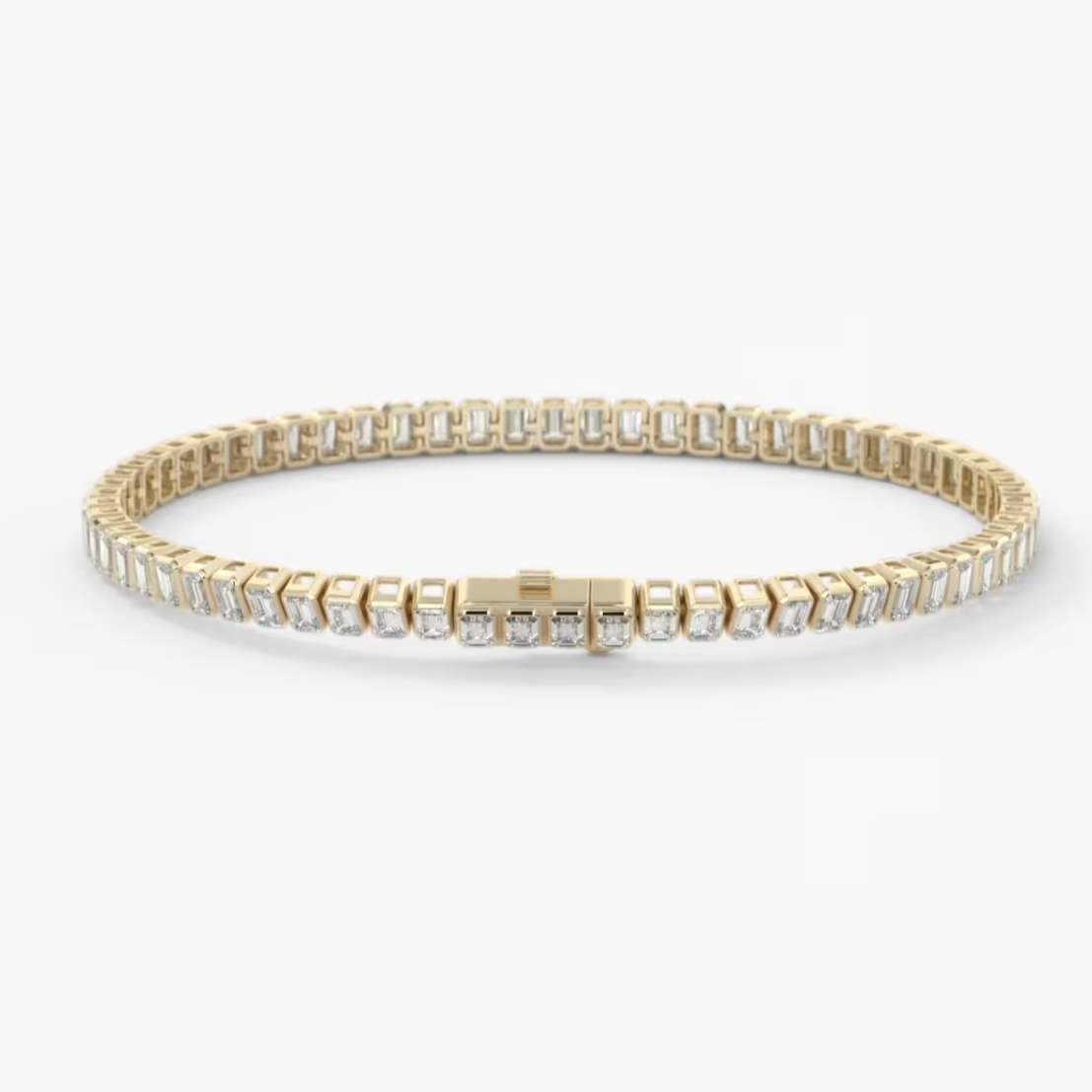 A gold tennis bracelet with clear rectangular-cut stones, displayed on a clean white background.