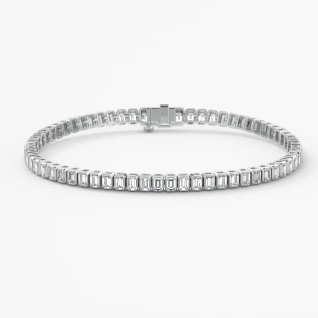 A white gold tennis bracelet featuring baguette-cut clear stones in a continuous link design, displayed on a clean white background.