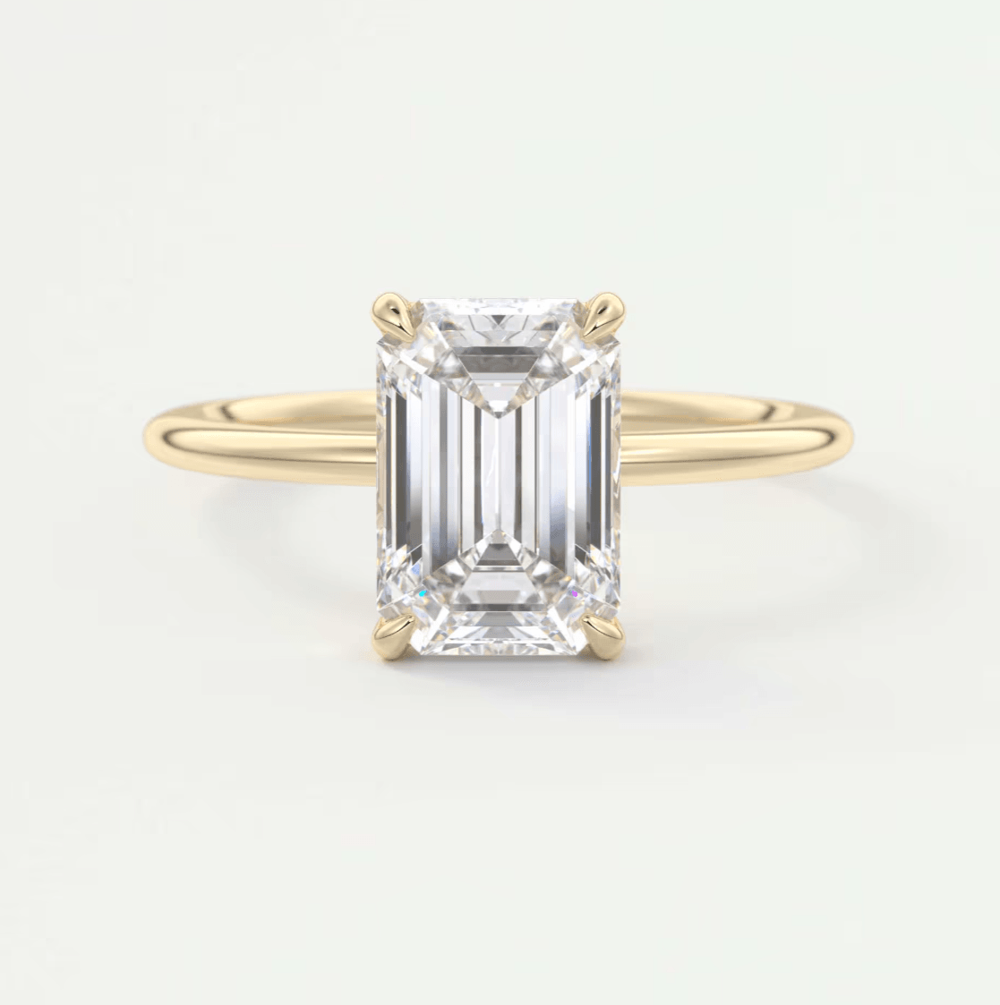 18k yellow gold emerald cut diamond engagement ring.