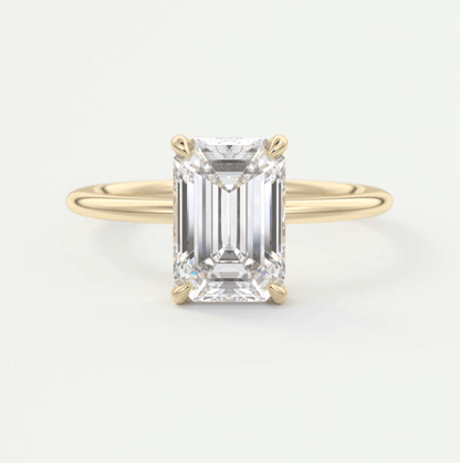 18k yellow gold emerald cut diamond engagement ring.