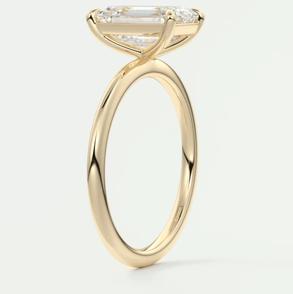 18k yellow gold engagement ring with a princess cut diamond and small round diamonds on the band.