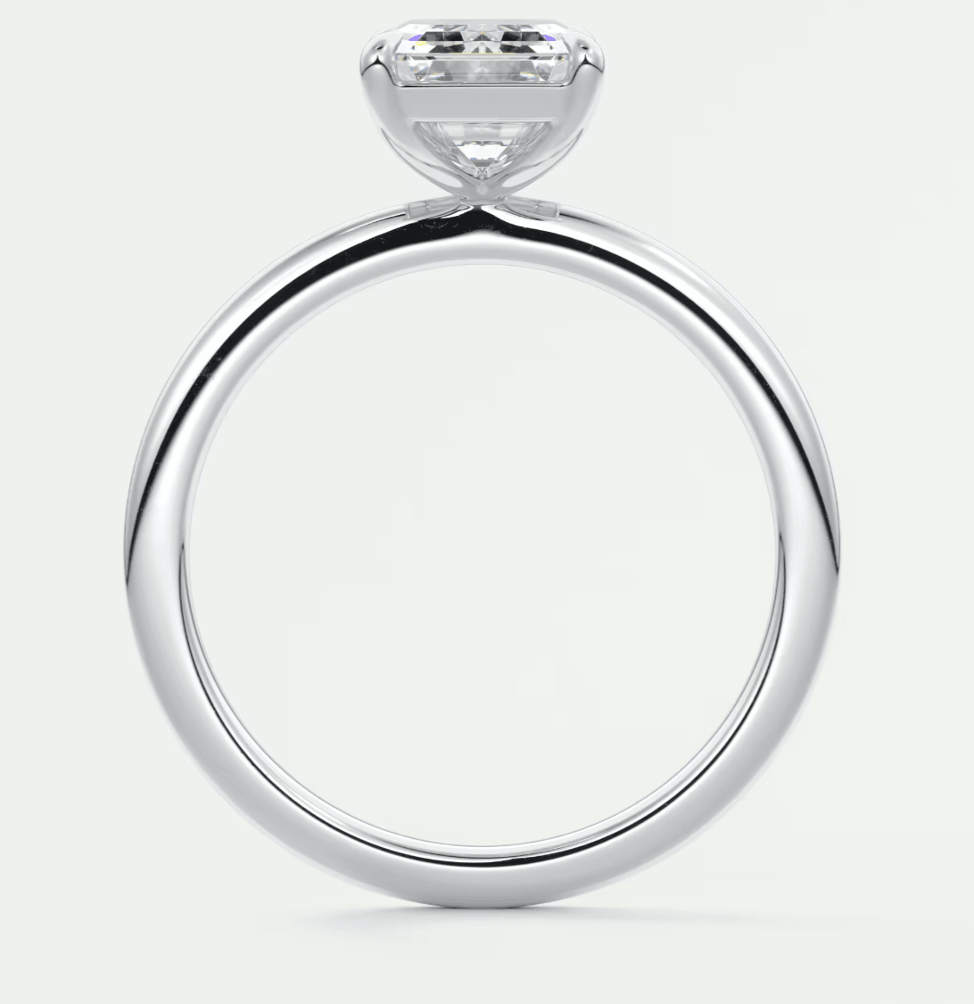 18k white gold solitaire diamond engagement ring with a round brilliant cut stone.