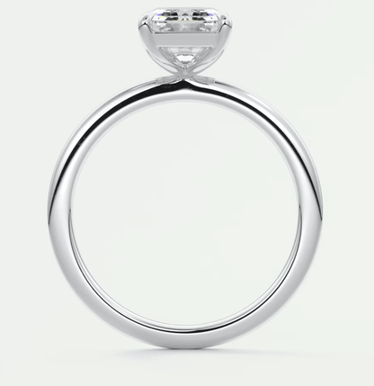 18k white gold solitaire diamond engagement ring with a round brilliant cut stone.