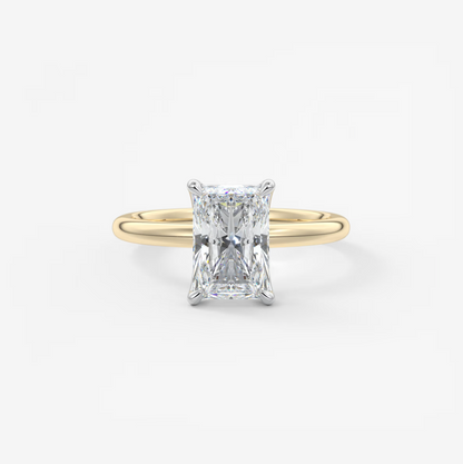 Gold ring with a diamond on a white background
