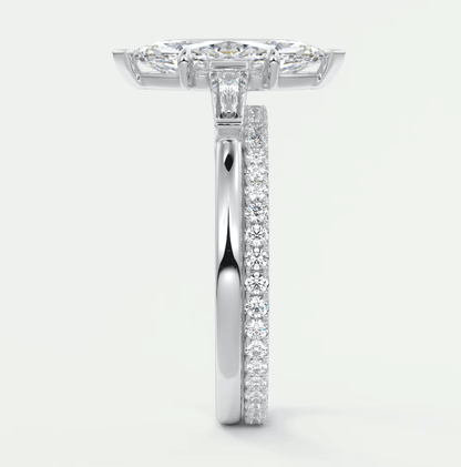 18k white gold diamond engagement ring with a princess cut center stone and pave set diamonds on the band.