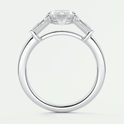 18k white gold engagement ring with a princess cut diamond and baguette side stones.
