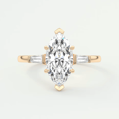 18k yellow gold marquise diamond engagement ring with baguette diamonds.