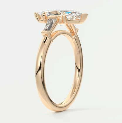 18-karat gold engagement ring with a cushion-cut diamond and baguette diamonds, featuring a classic solitaire design.