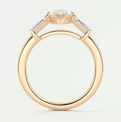 18k yellow gold engagement ring with three baguette diamonds.