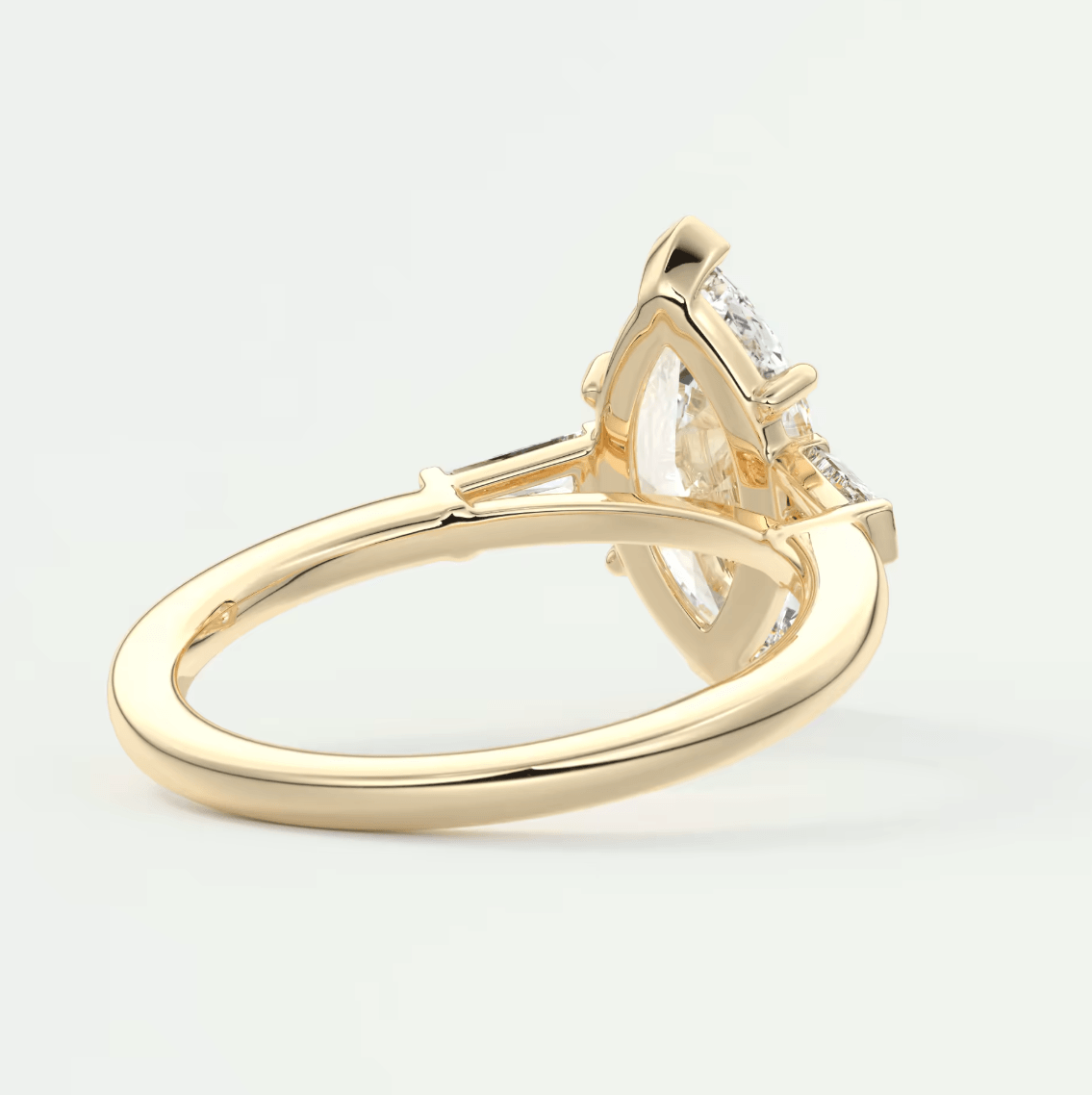 18k yellow gold engagement ring with a princess cut diamond and small accent diamonds.