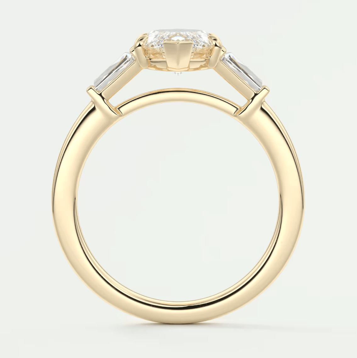 18k yellow gold engagement ring with baguette diamonds.