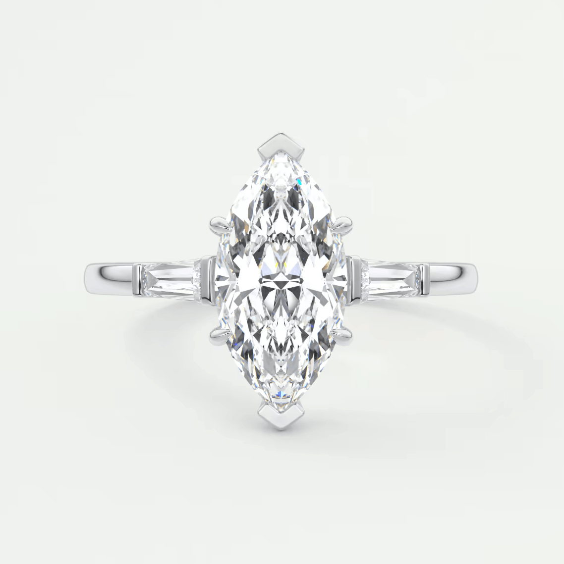 18k white gold marquise diamond engagement ring with baguette accents.