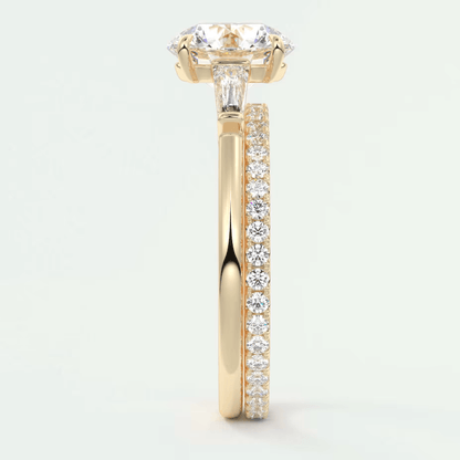18k yellow gold engagement ring with a princess cut diamond and pavé side stones.