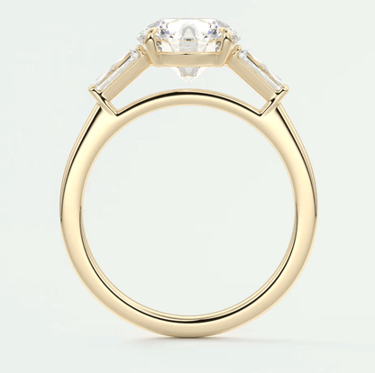 18-karat yellow gold engagement ring with a cushion-cut diamond and baguette diamonds, featuring a classic solitaire design.