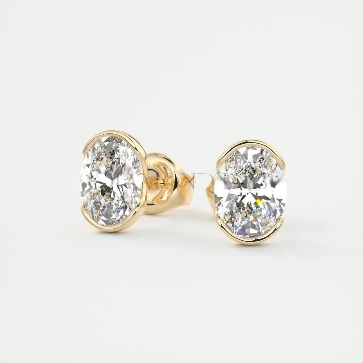 18k gold diamond stud earrings with bezel setting.