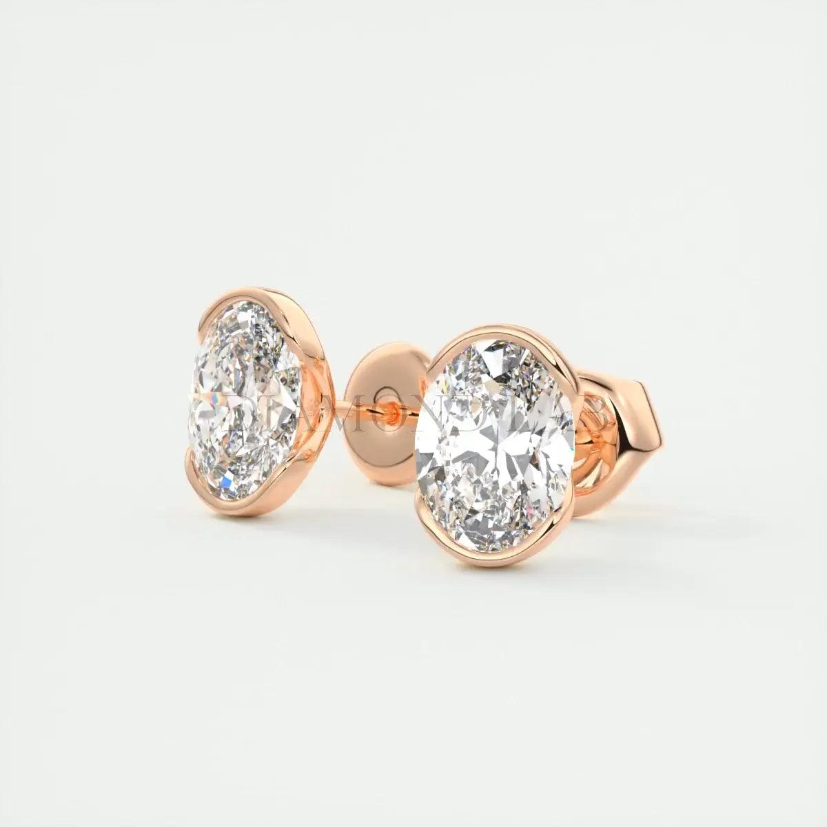18-karat rose gold diamond stud earrings.