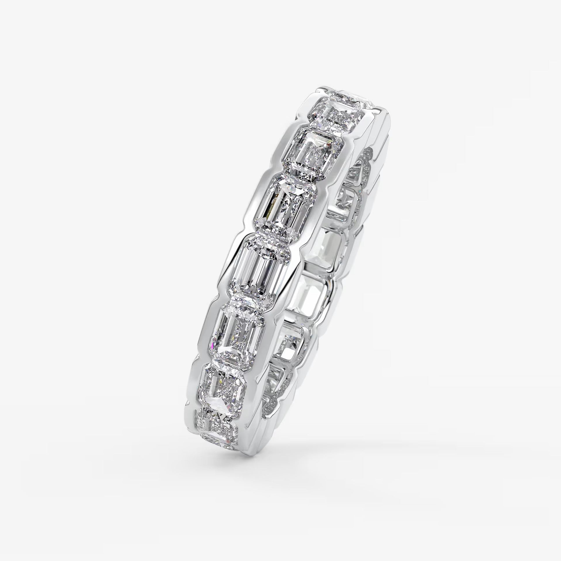 Solara east-west emerald half-bezel eternity band