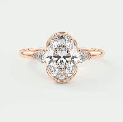18k rose gold diamond engagement ring with a marquise-cut center stone and small diamonds on the band.